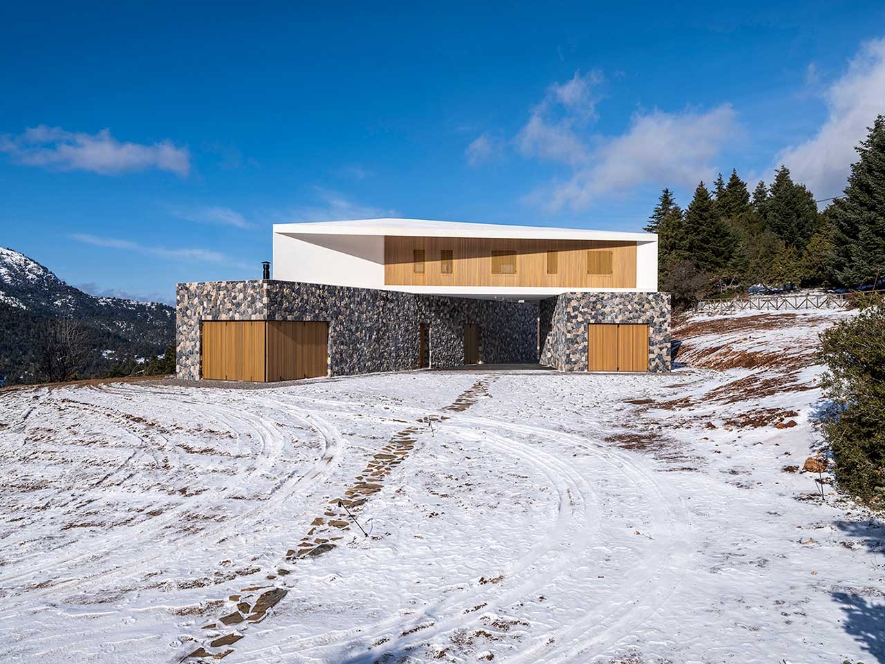 A Greek Mountain House Made Of Three Angled Volumes