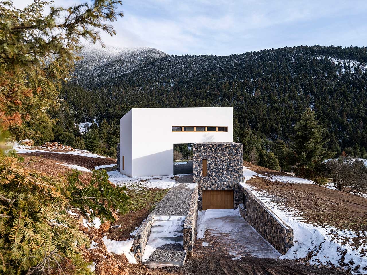 A Greek Mountain House Made Of Three Angled Volumes